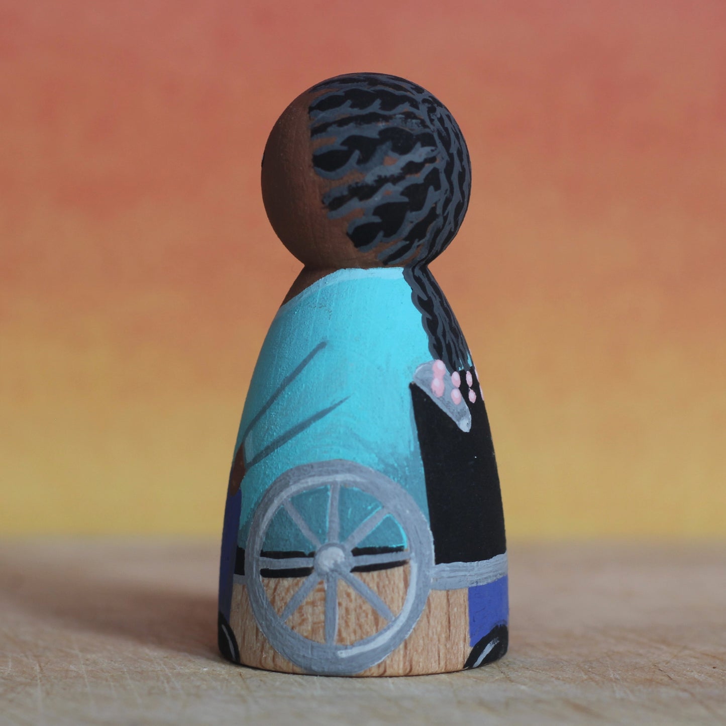 Peg doll in a wheelchair – splash of character